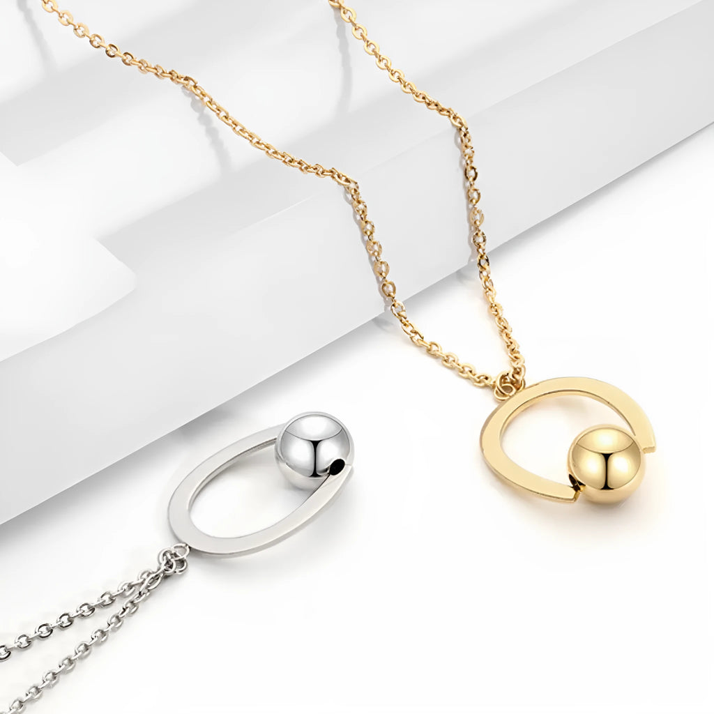 Adjustable stainless steel necklace with geometric pendant on a cross chain in gold finish.