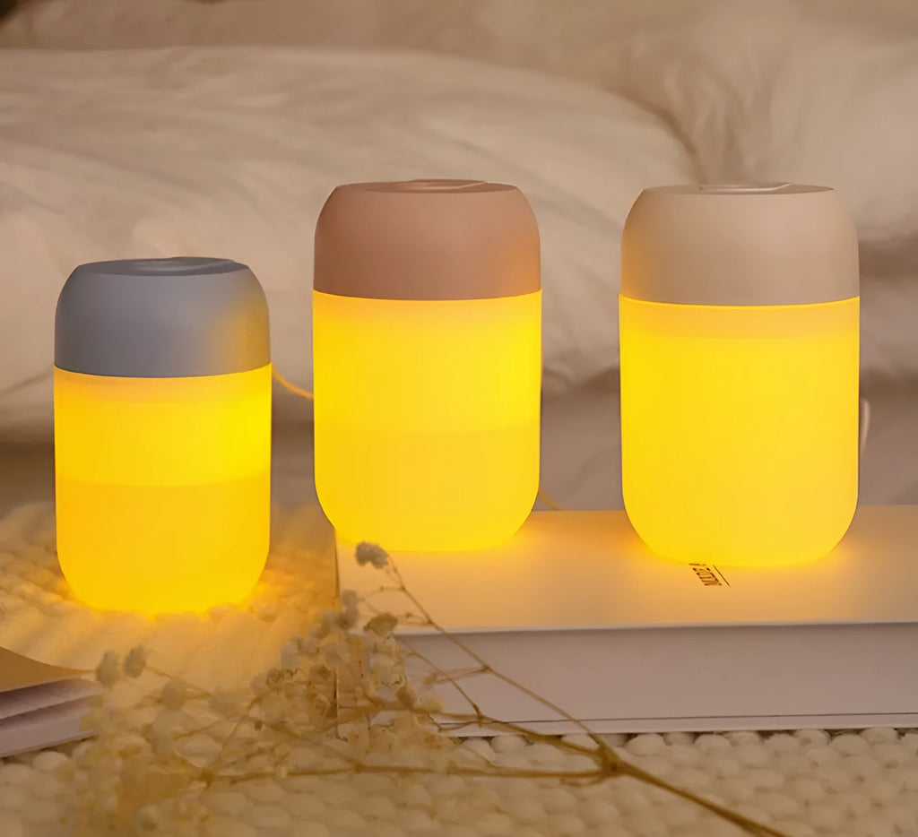 Small white cylindrical USB humidifier with aromatherapy function for desk use