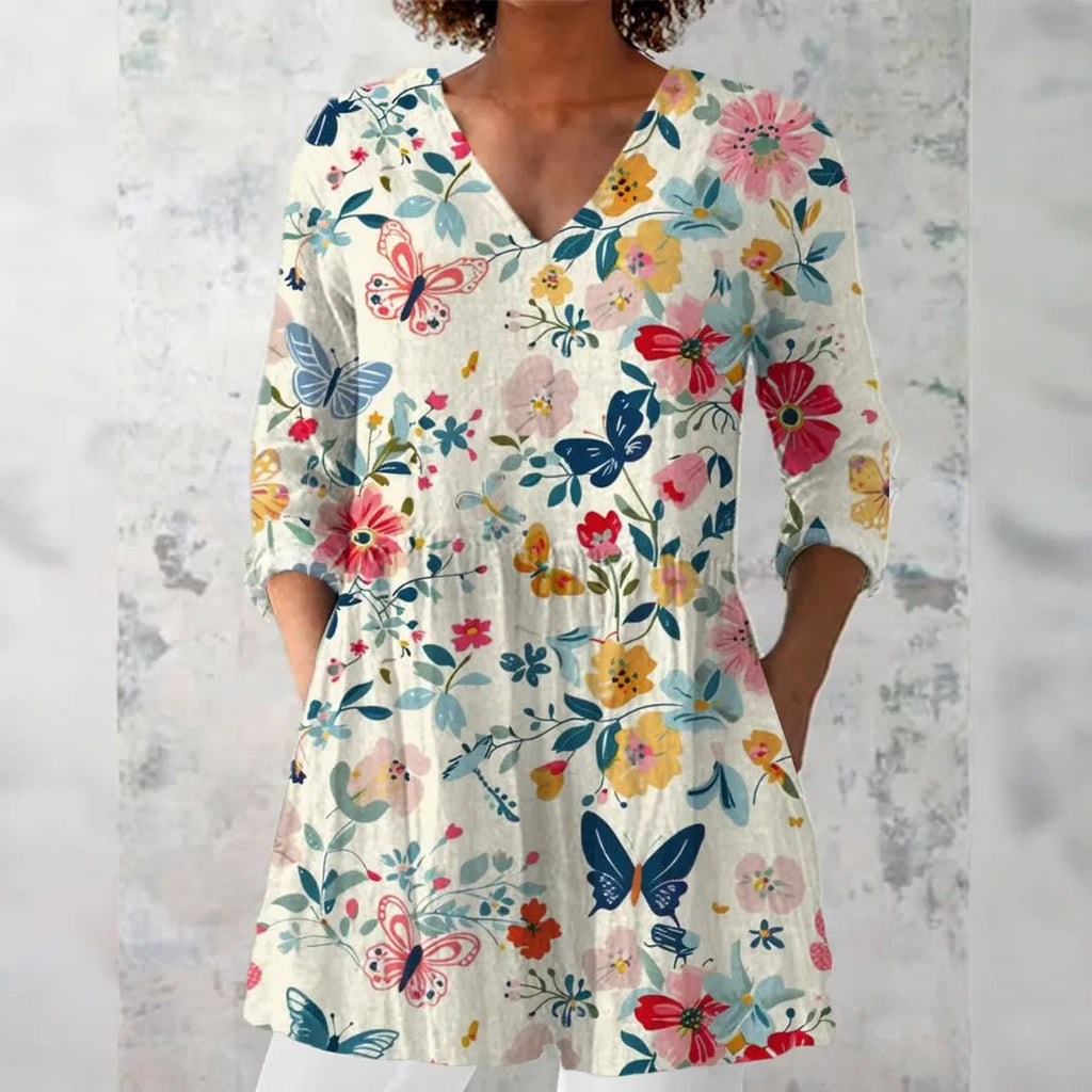 Women's retro slim fit printed long-sleeved top in a floral pattern, showing front view.