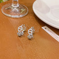 Ladies electroplated copper earrings with thick gold plating in casual diamond design