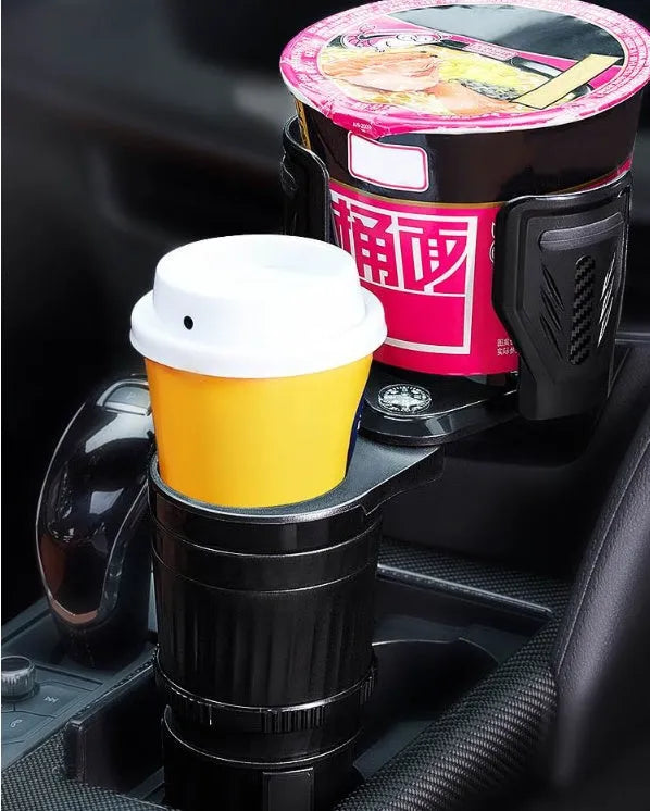 Black car cup holder with retractable base and carbon fibre pattern, shown holding a water bottle.