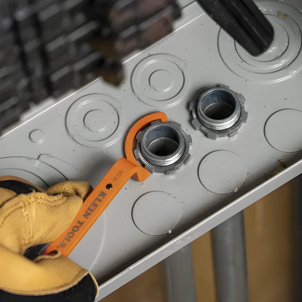 Orange, grey, and black magnetic crescent wrenches with catheter locking mechanism on one tool