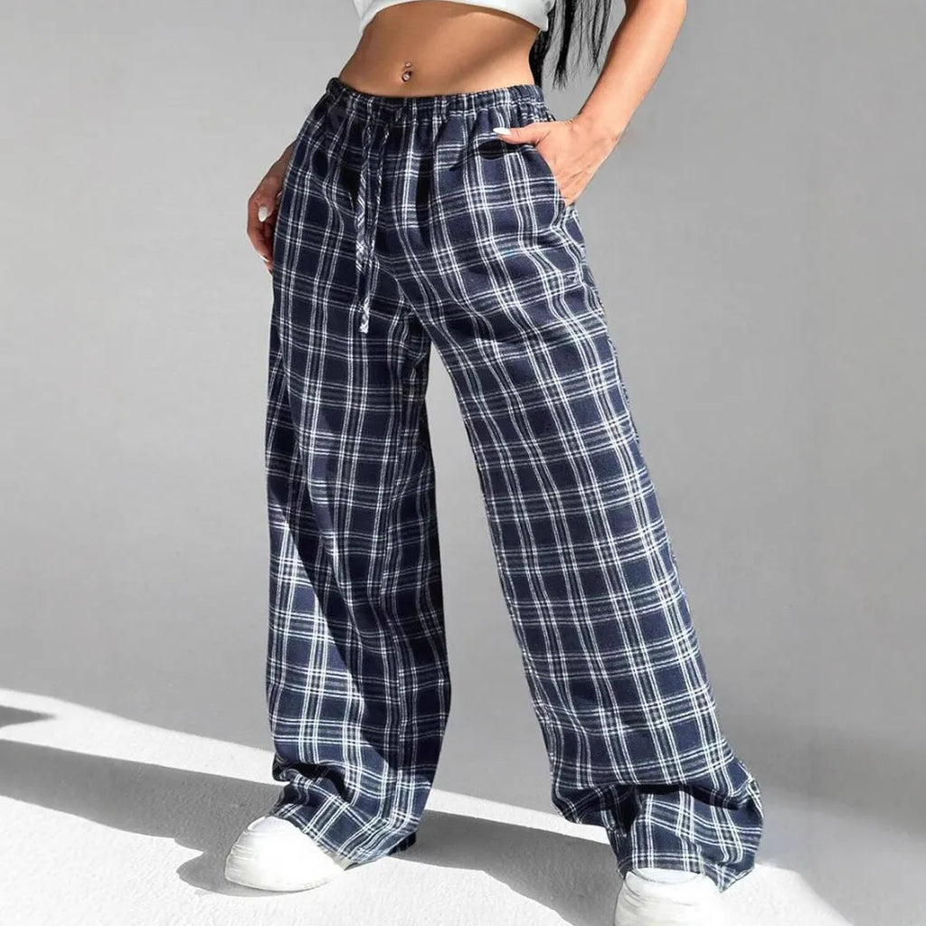Women's plaid trousers with drawstring waist and side pockets in red or blue colours