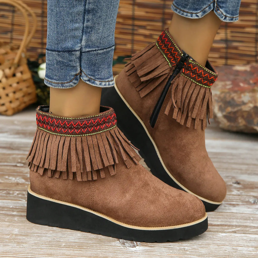 Women's dark brown suede wedge ankle boots with side zip and decorative tassel.