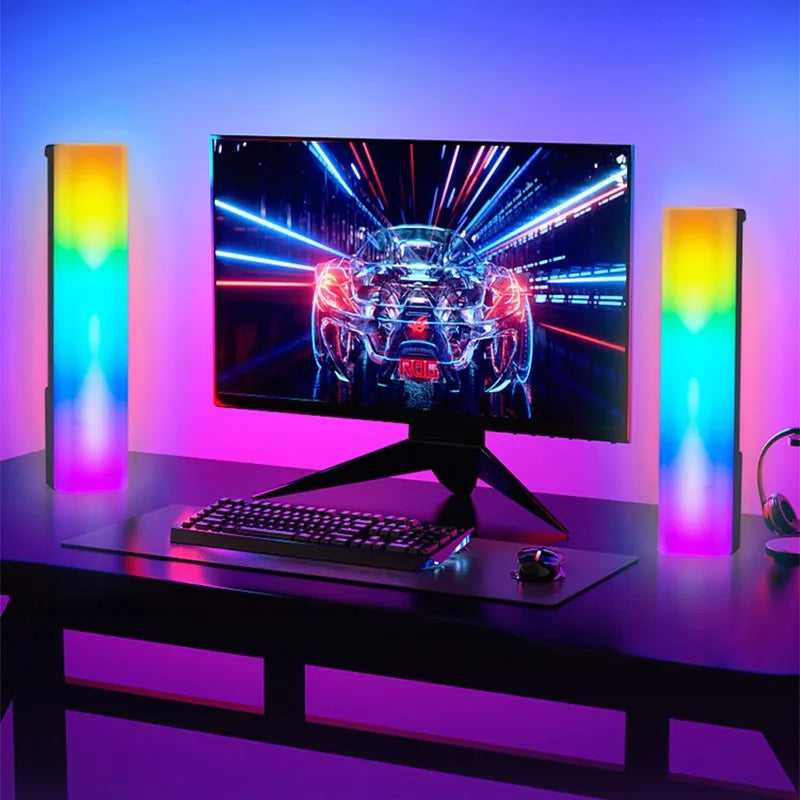 Black and white 3D RGB music rhythm ambiance lamp on a table with USB cable.