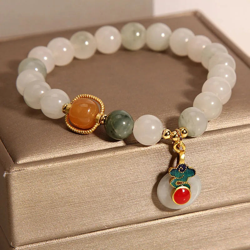 Ice jade crystal bracelet for women with pearl details and a peace jade buckle.