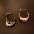 Twisted geometric metal earrings in gold and silver electroplated finishes