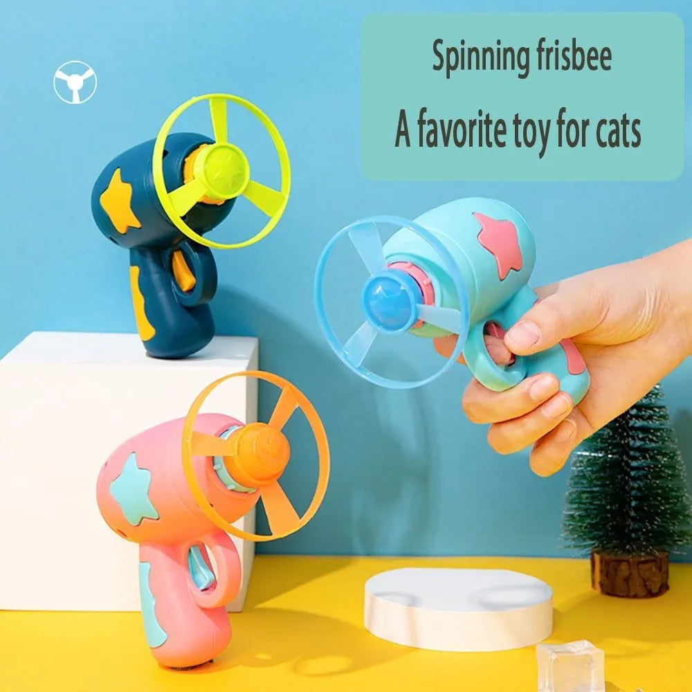 Blue plastic cat toy gun with spinning Frisbee for indoor feline play