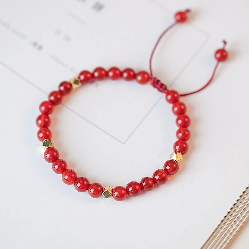 Hand-woven red agate bracelet with diamond beads in ethnic woven pattern