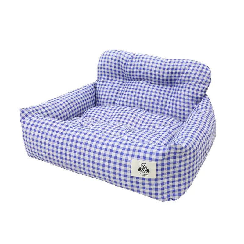Car-mounted pet outing nest in grey and blue plaid options showing stain-resistant cloth construction