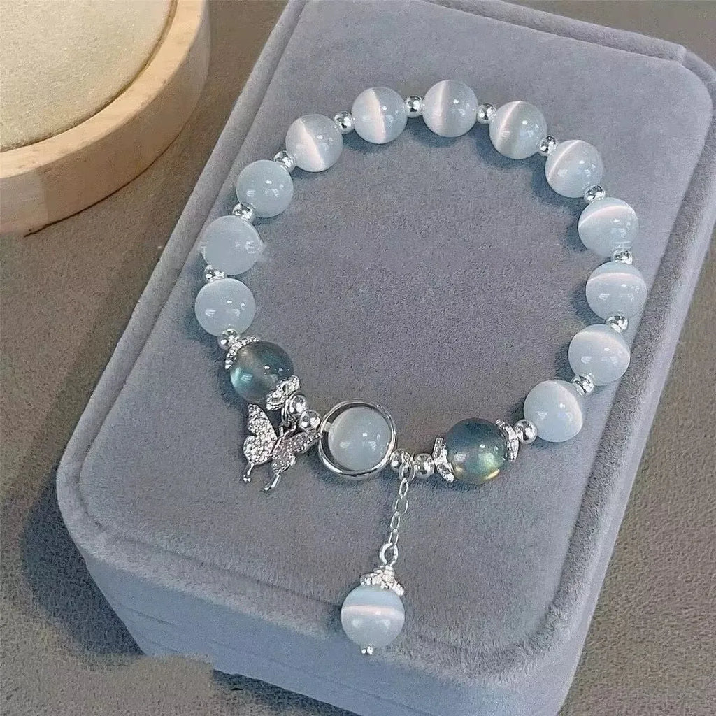 Glass bracelet with butterfly design and blessing card beads in moonlight colours