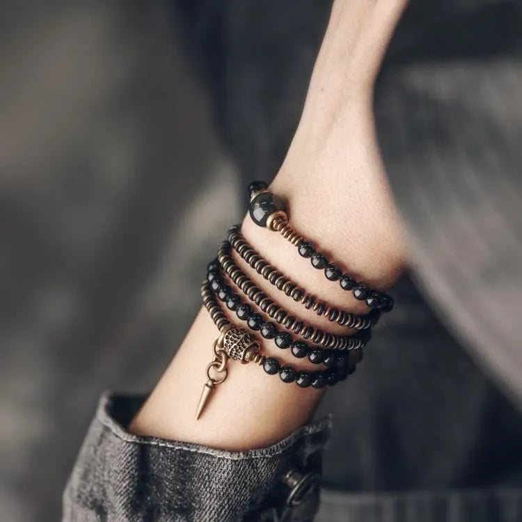 Black geometric layered bead bracelet with retro colourful design elements