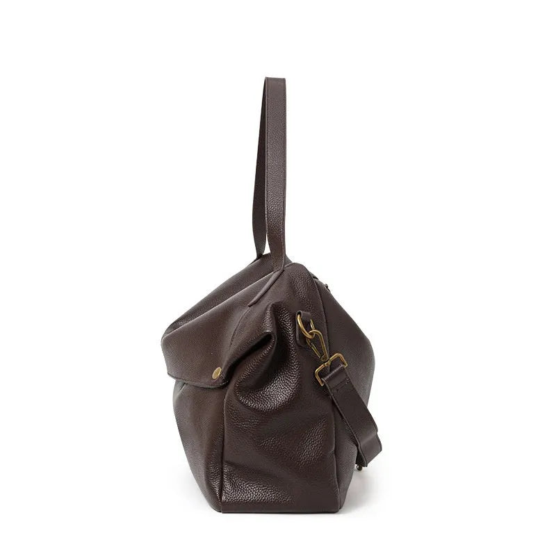 Brown genuine leather women's shoulder bag with horizontal square shape showing interior zipper compartment