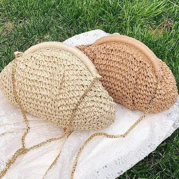 Women's woven straw shoulder bag with shell shape in khaki colour featuring chain detail