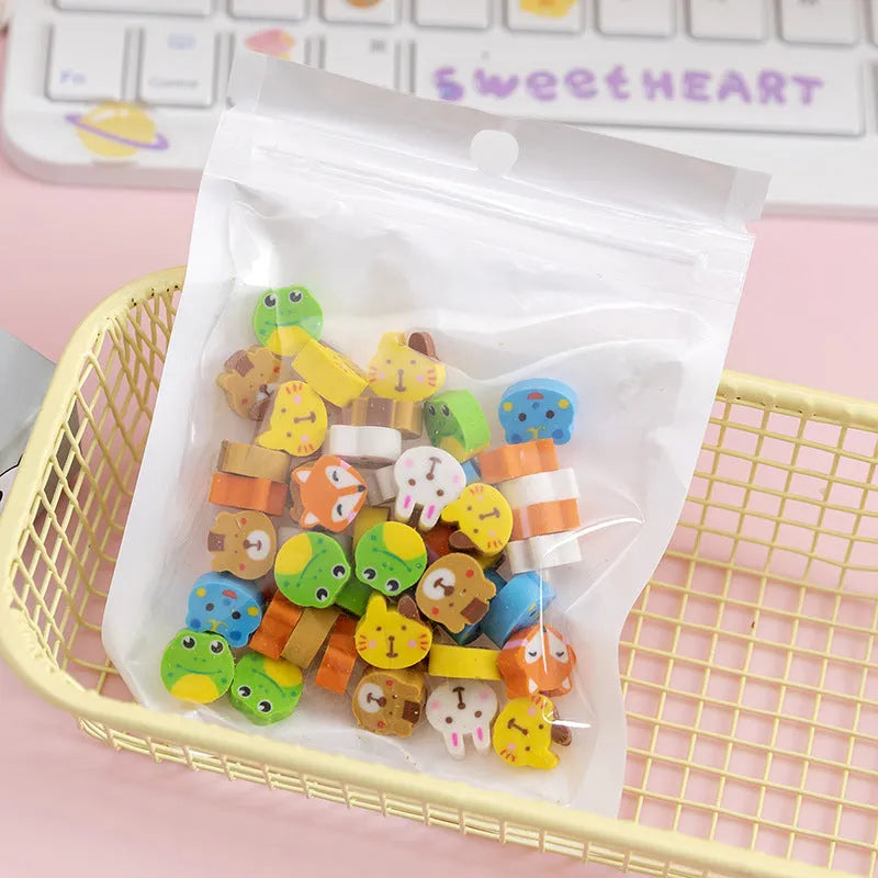 Pearlescent bag with 50 colourful TPR cartoon mini erasers, 1-1.5cm, showing fruit, animal, and themed shapes.