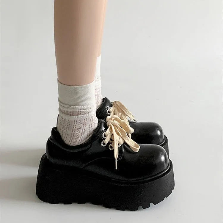 Matte black women's lace-up shoes with a thick rubber sole and a 6-8cm English muffin heel