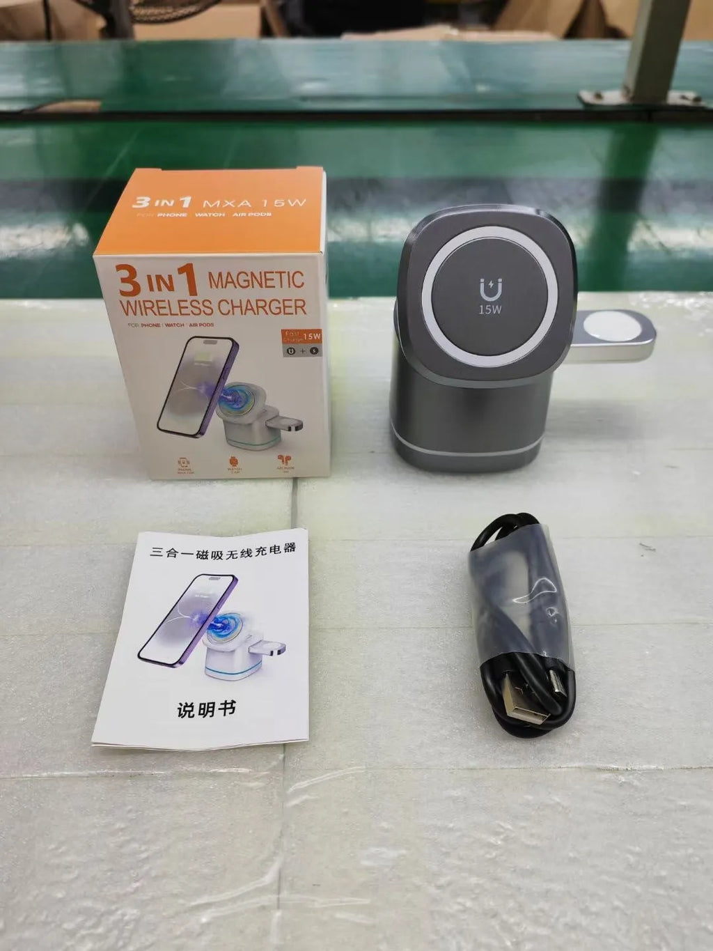 Three-in-one folding magnetic wireless fast charging charger in Iron Grey with phone, earphones and watch placed on charging pads