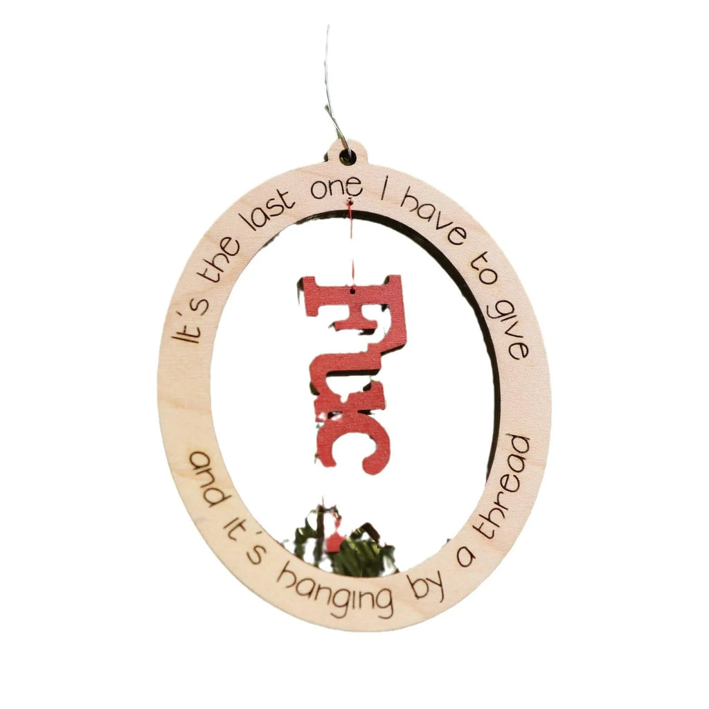 Basswood Christmas tree pendant in colour finish, 9.6x7.7cm, on a tree branch