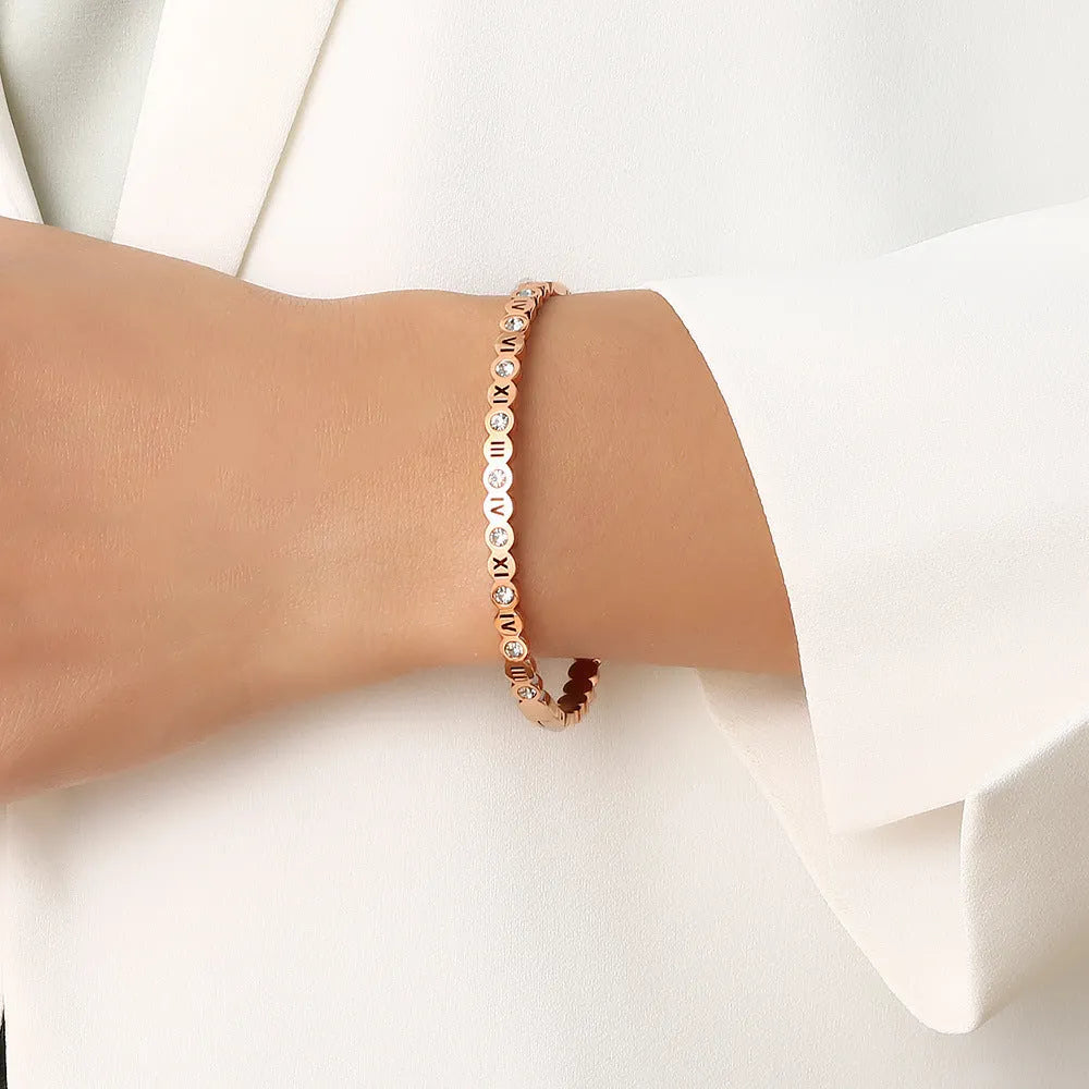 Korean style titanium steel bracelet with numerical design in gold, rose gold, and steel colour options.