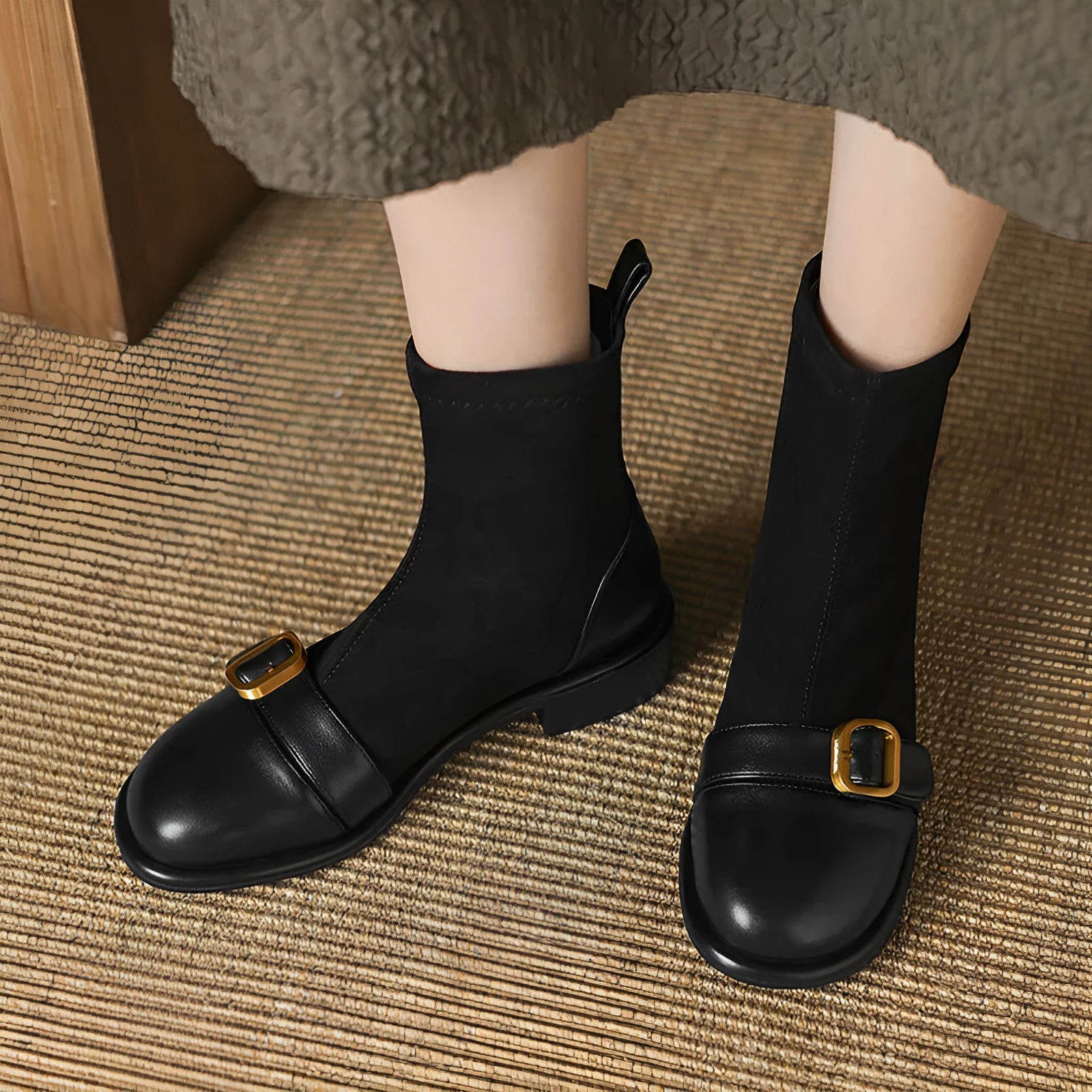 Women's black low heel lace-up Martin boots with round toe and rubber sole.