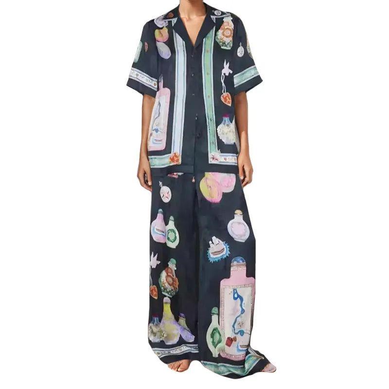Black women's casual set with cartoon print, featuring a cardigan and matching trousers.