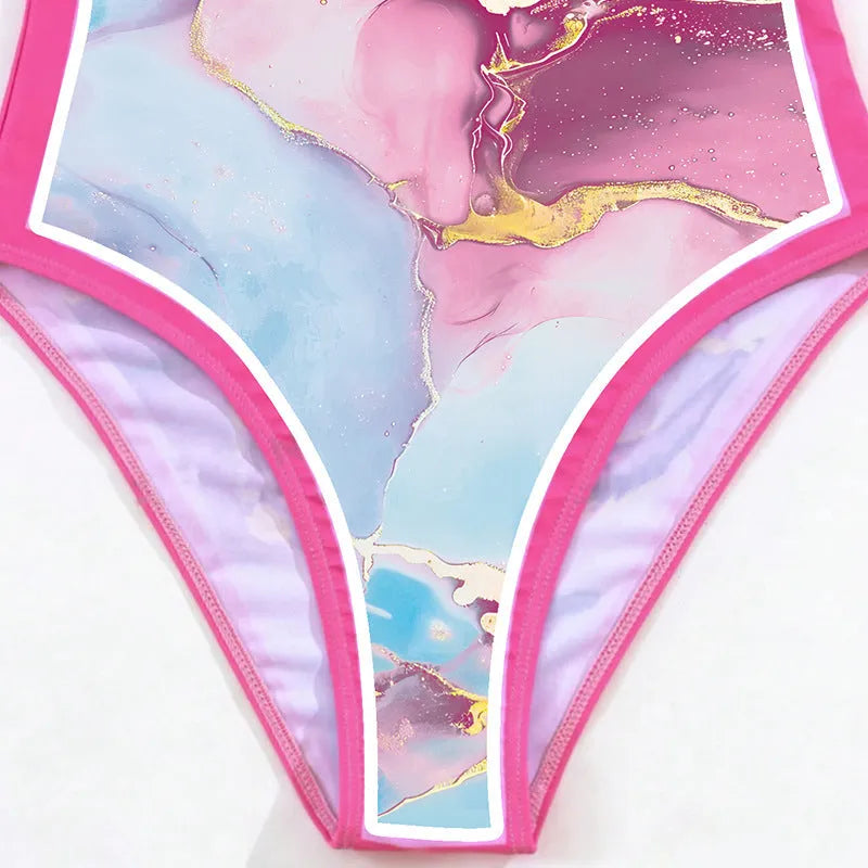 Pink one-piece printed sheath swimsuit for women with sun protection and matching skirt for beach or pool