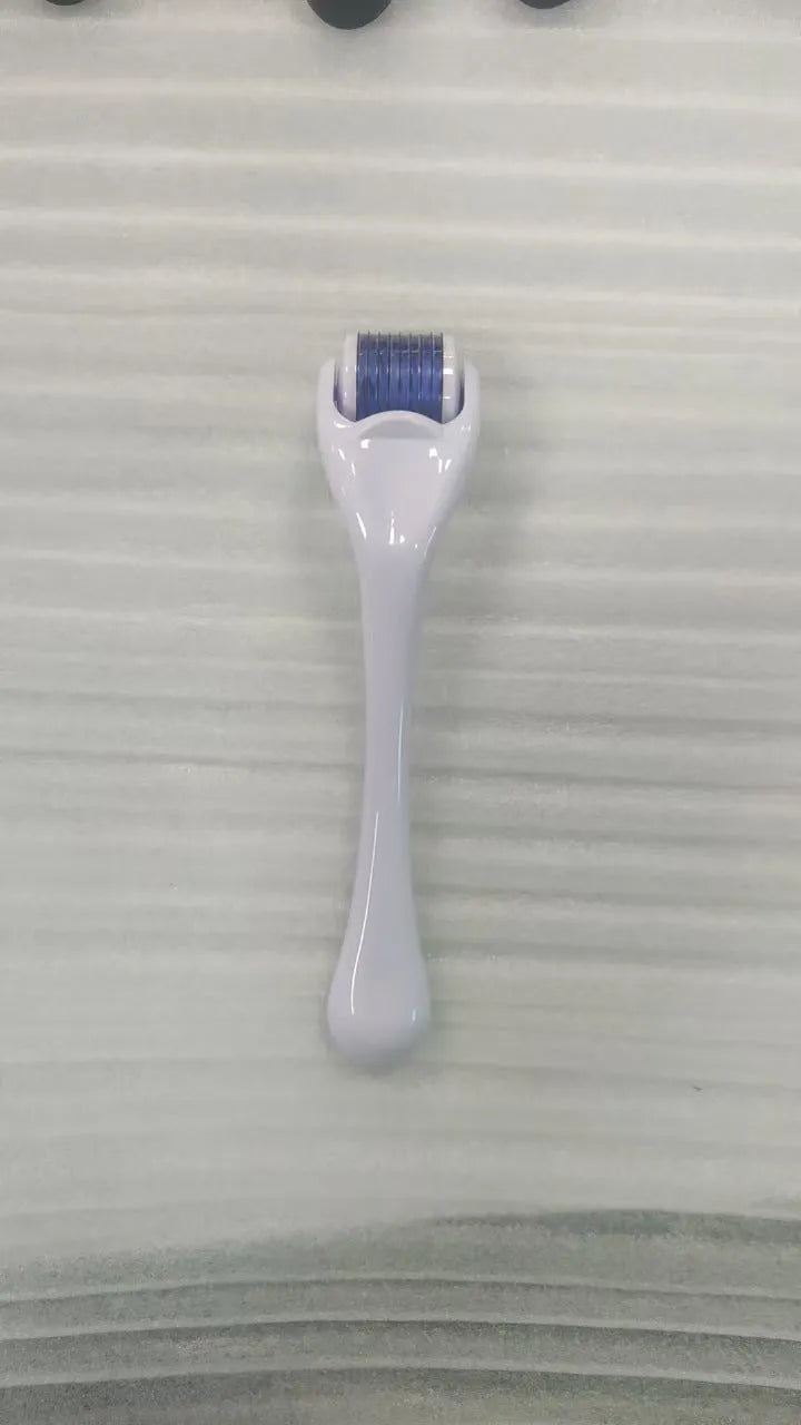 Black handle microneedle roller with purple wheel showing 540 needles, next to white and blue handle options.