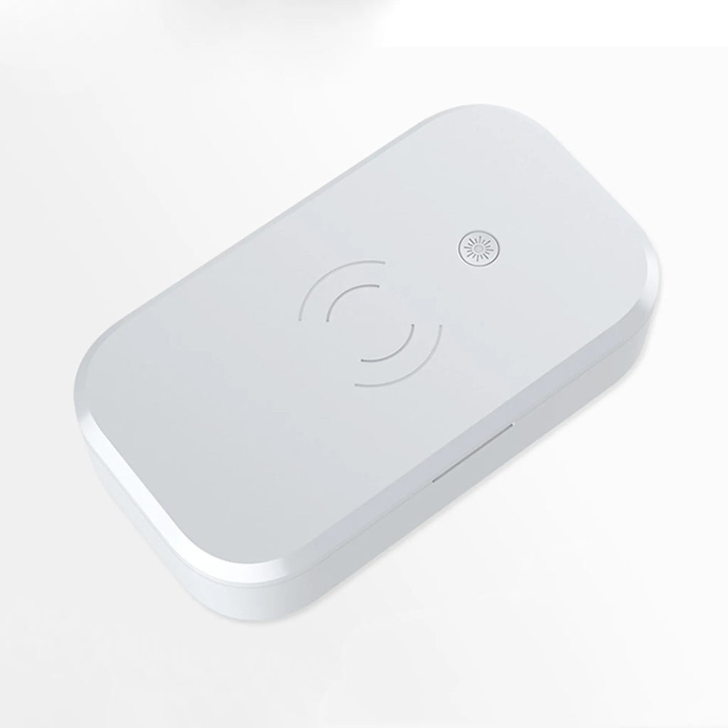 A white ultraviolet disinfection box with wireless phone charging pad on top, for nail art tools.