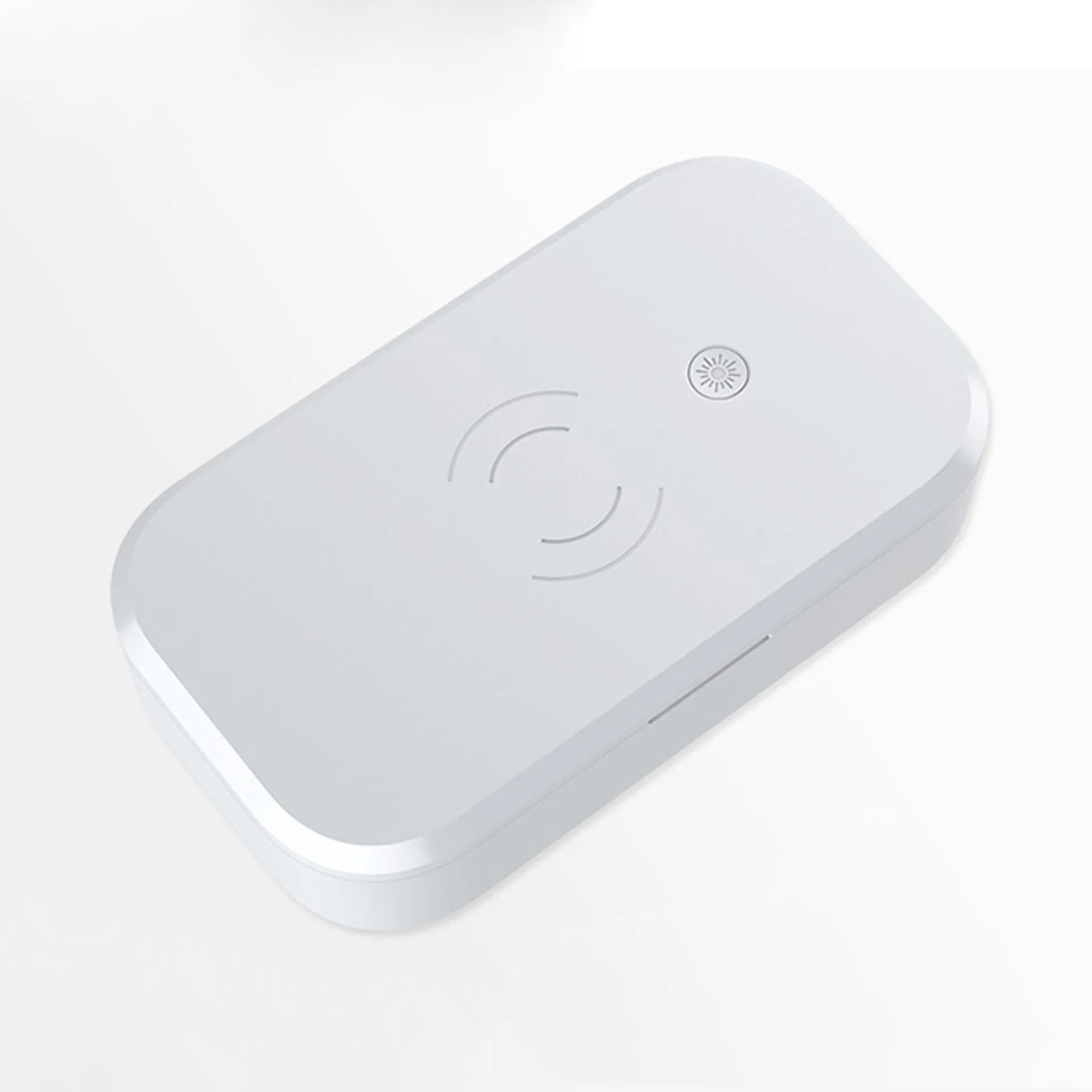 A white ultraviolet disinfection box with wireless phone charging pad on top, for nail art tools.