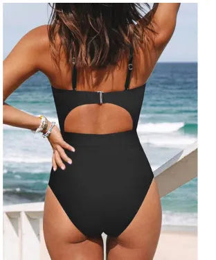 Women's solid colour cross backless one-piece swimsuit on a mannequin