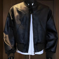 Men's slim-fit black PU leather motorcycle jacket with litchi grain texture and extended length