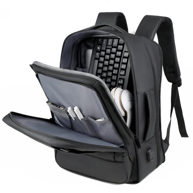 Black or grey waterproof oxford cloth backpack with curved shoulder straps showing 20-35 litre capacity
