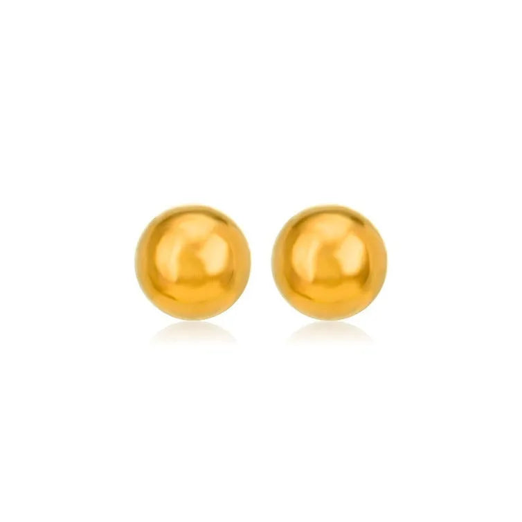 Minimalist round ball stud earrings in gold and silver tones on a plain background.