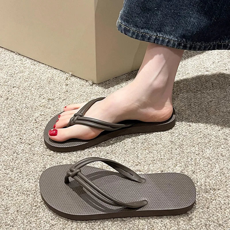 Men's casual PVC flip flops in beige with toe-covering style and injection moulded sole.