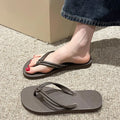 Men's casual PVC flip flops in beige with toe-covering style and injection moulded sole.