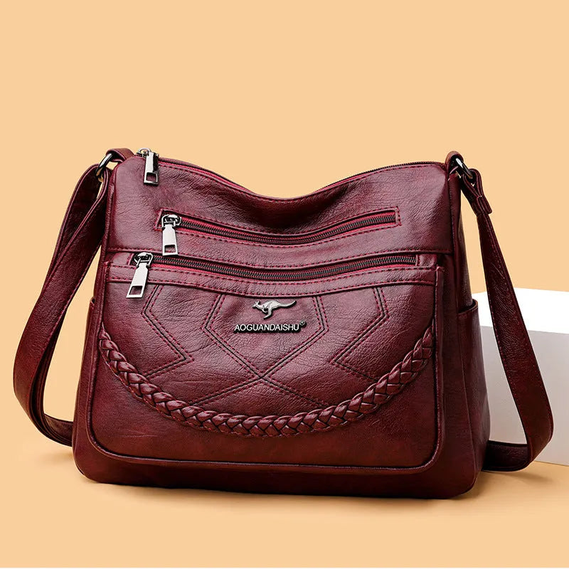 Soft PU leather women's crossbody shoulder bag in horizontal square shape with internal zipper compartments
