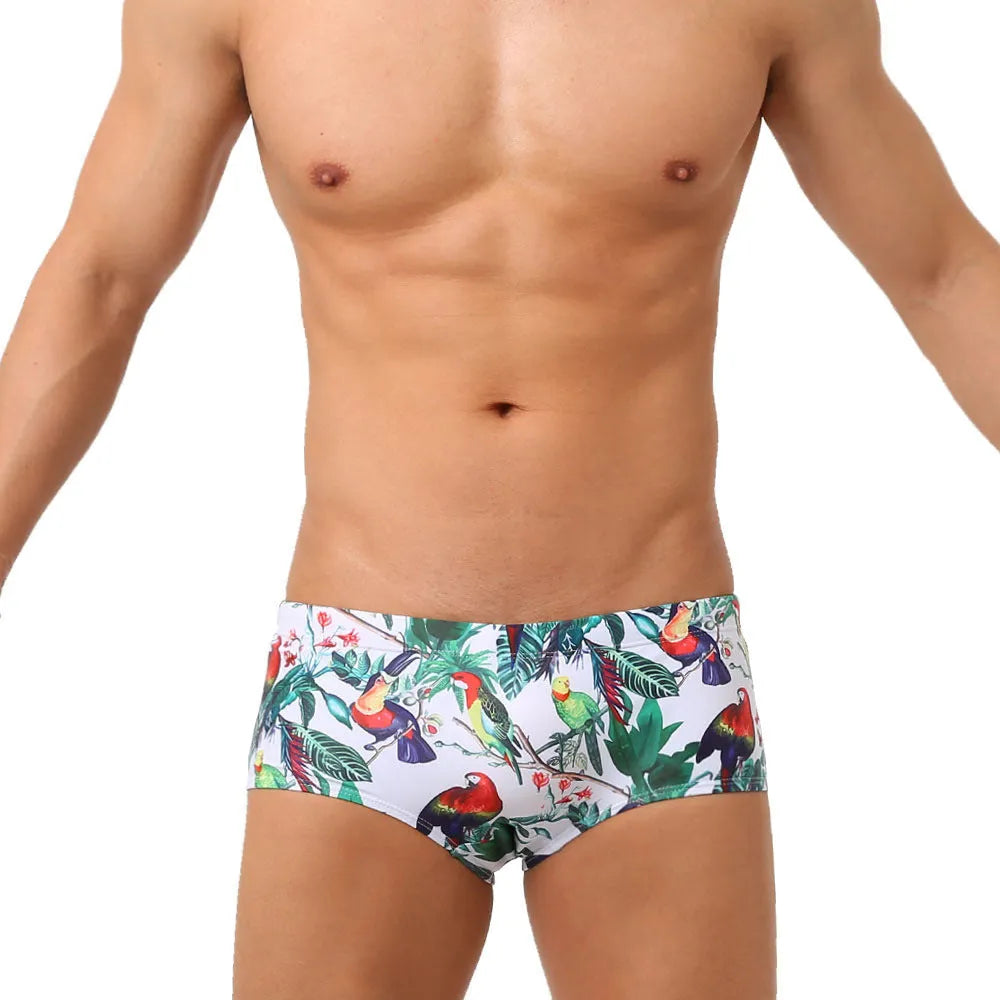 Men's floral and bird print swimming trunks in nylon fabric with elasticated waistband
