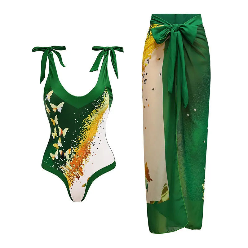 Solid colour women's one-piece swimsuit with spaghetti straps and a matching detachable skirt.