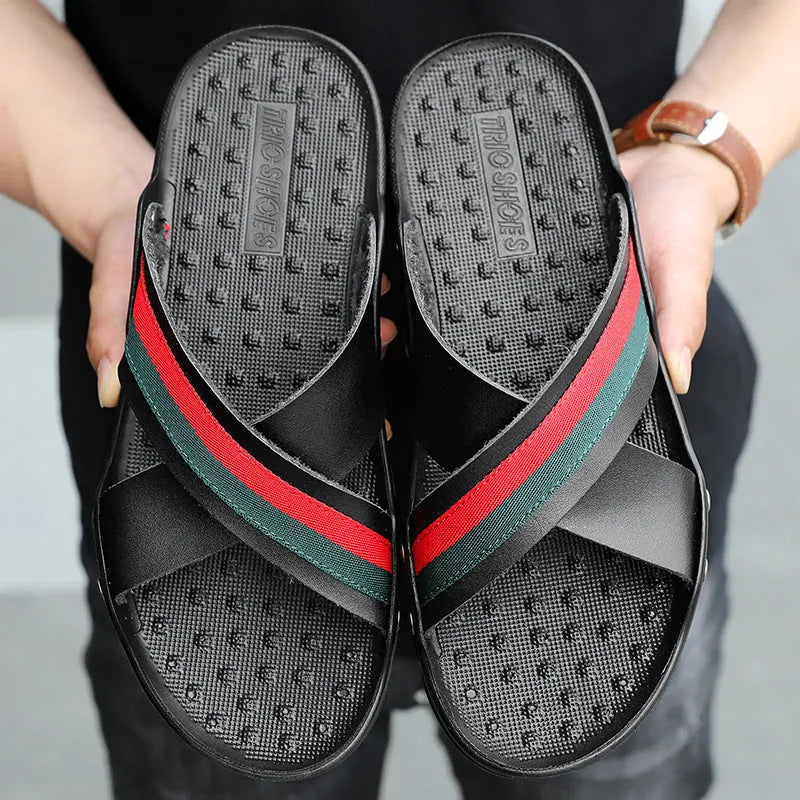 Men's leather flip-flop sandals in white, blue, and black on a beach background, showing cowhide upper and PU sole.