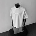 Men's loose fit cotton t-shirt with short sleeves and letter print in black, white or light grey