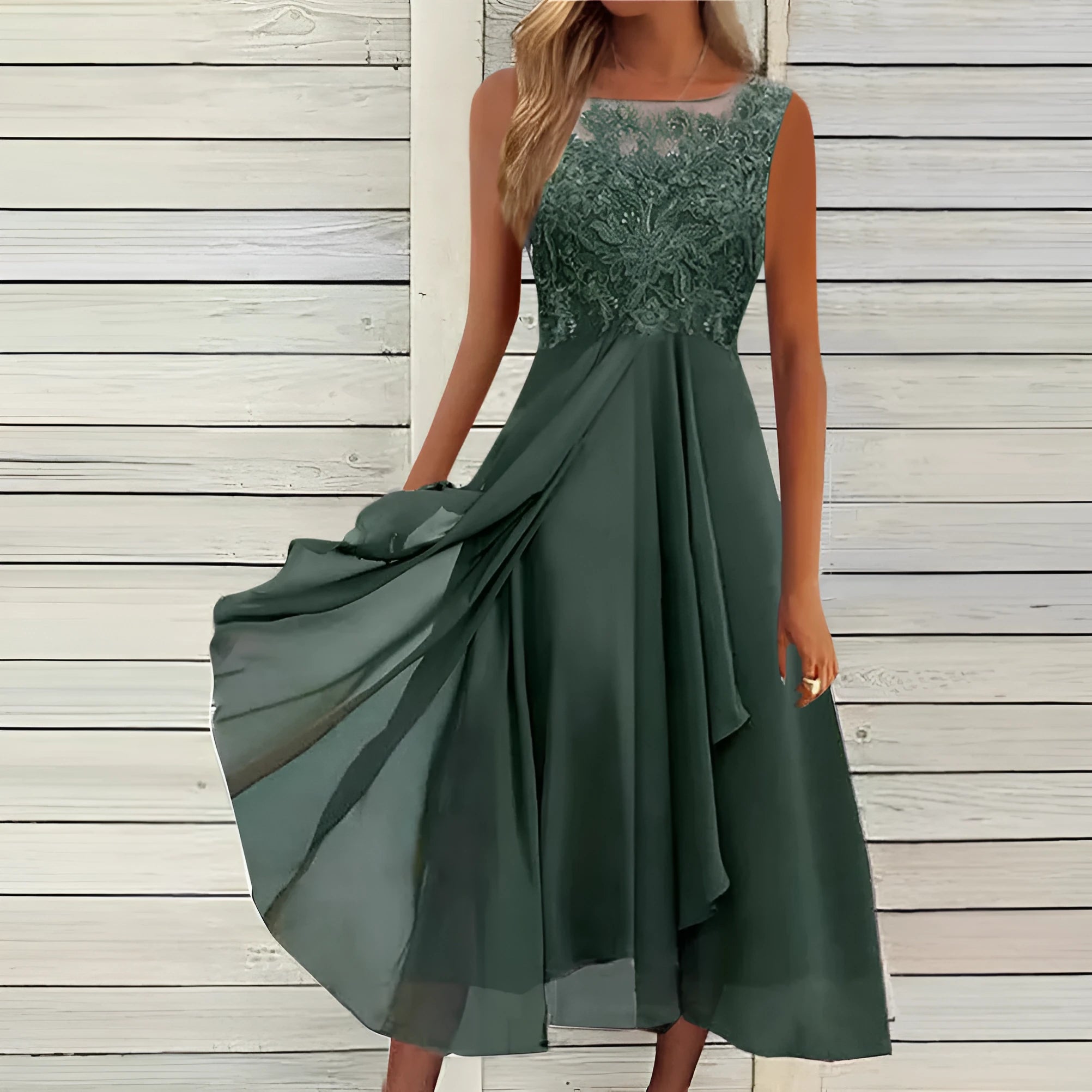 Women's sleeveless chiffon dress with lace hollow-out stitching in green, shown in a princess-style mid-length cut.