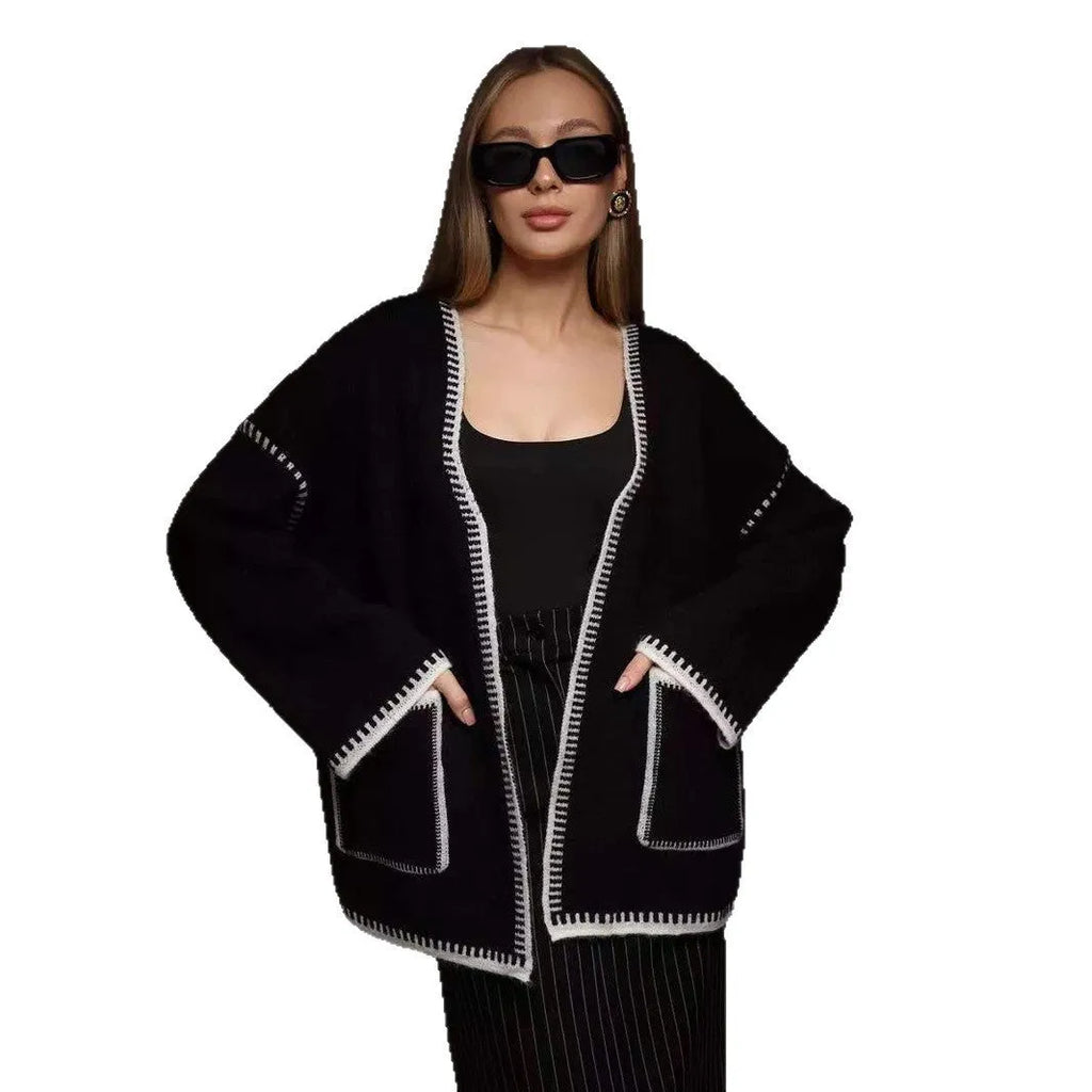 Loose lace-up front knitted cardigan in camel colour, showing mid-length fit and long sleeves.