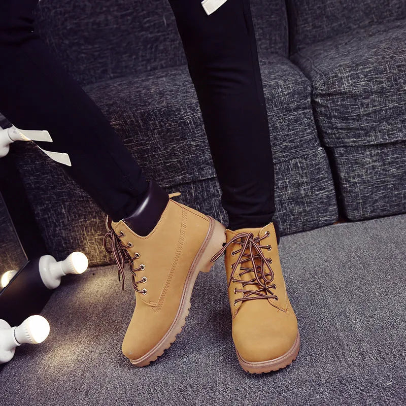 Pink men's Martin boots with velvet lining, round toe, and front lace-up closure on a flat bottom.