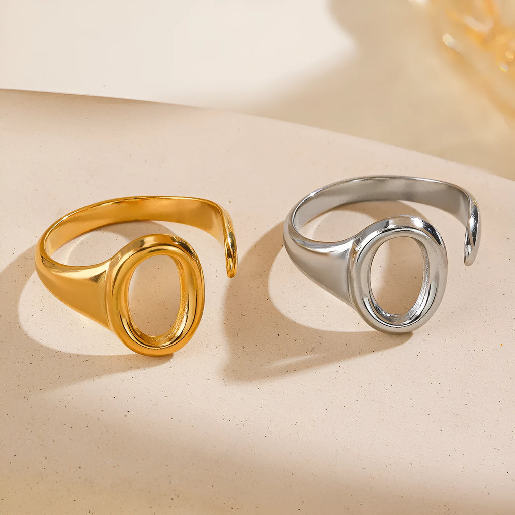 Oval ins style adjustable stainless steel ring in gold and steel colours on white background