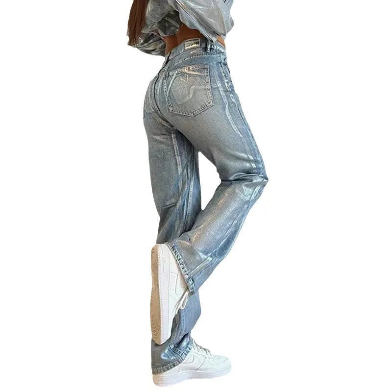Washed blue high-waist straight-leg jeans with hot silver contrast stitching on a mannequin