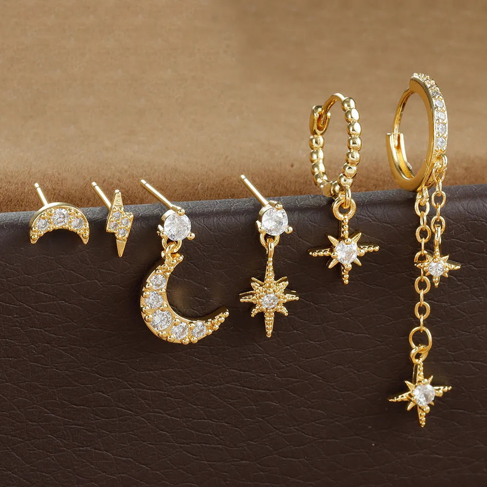 Gold colour XINGX chain tassel earrings set with six pieces showing zircon stud details