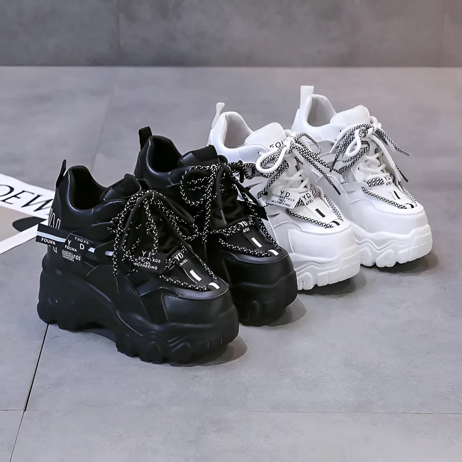 Women's white mesh platform sports shoes with cross strap and round toe on rubber sole.