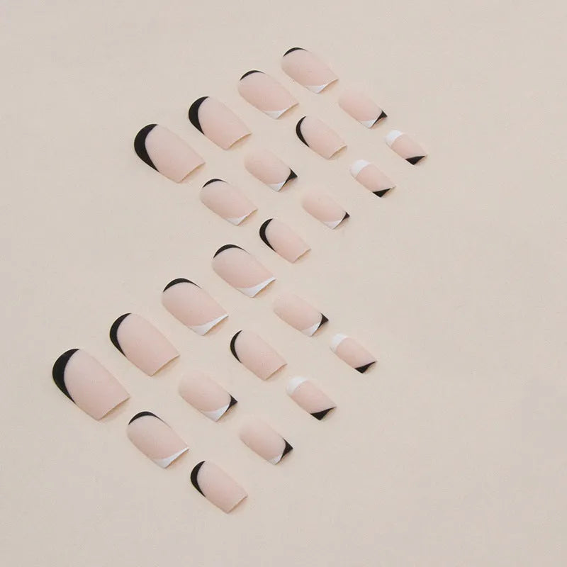 Black and white frosted artificial nails with French-style tips in plastic wearable set
