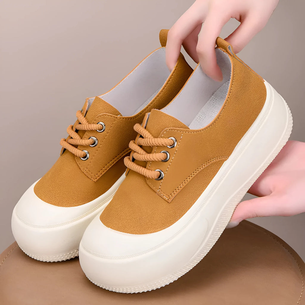 Women's beige suede platform loafers with round toe and front lace-up, on a white background.