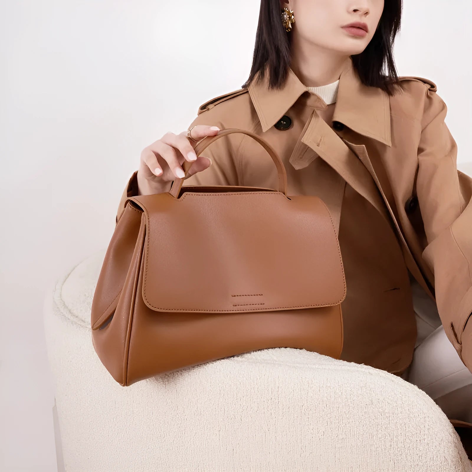 Soft genuine leather women's shoulder messenger bag in black, horizontal square shape with sewing thread detail